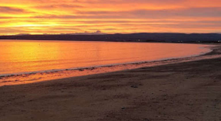 sunset-with-alba-campers-at-fortrose-bay-campsite